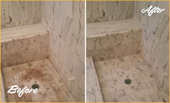 Before and After Picture of a Bogart Marble Shower Honed to Remove Dark Stains